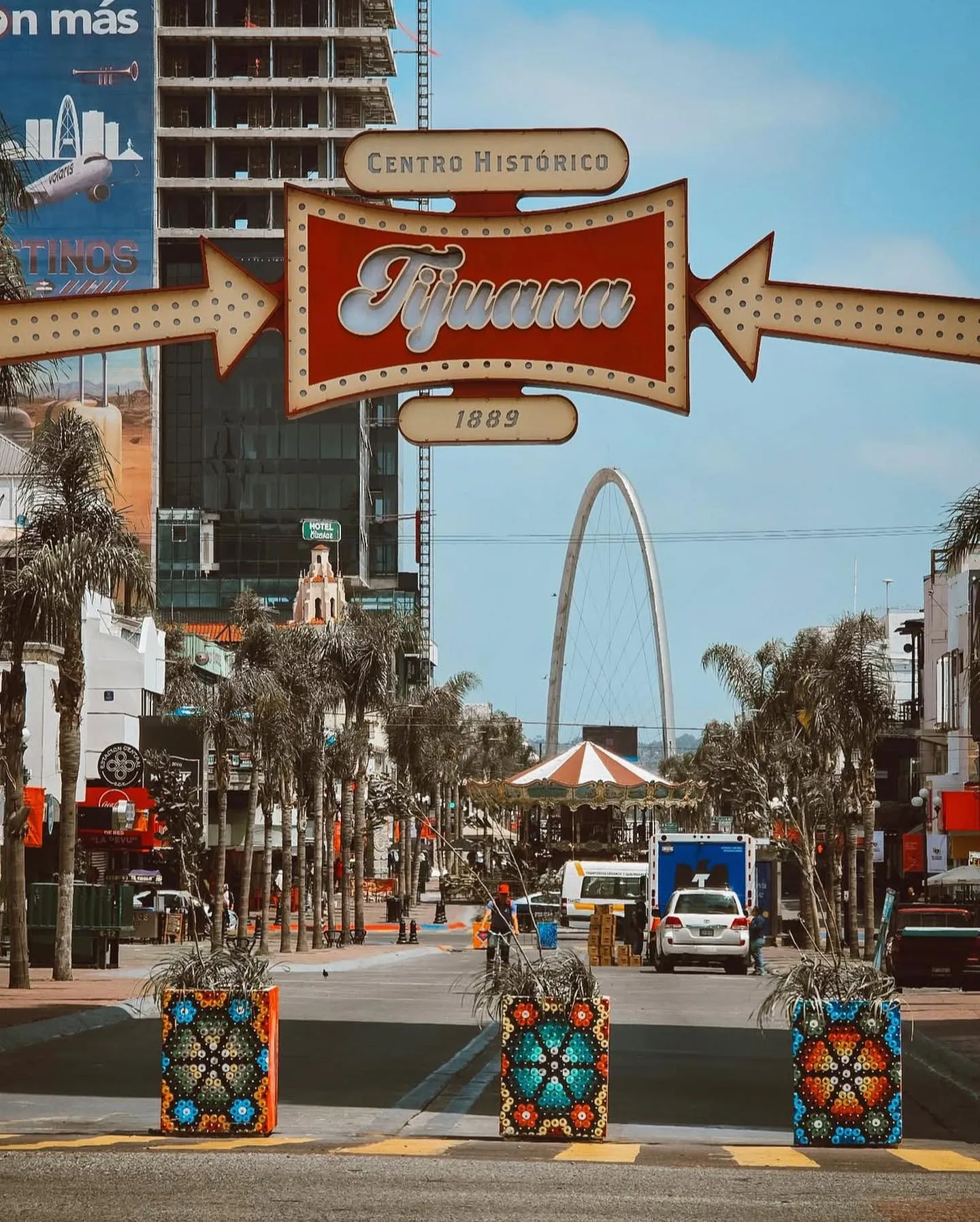 The Tijuana sign over Avenida Revolución, with the arch behind it
